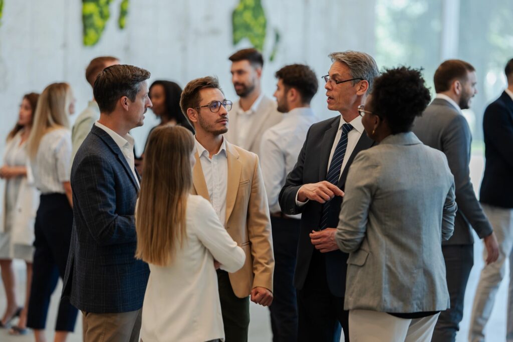 Business people networking and discussing during conference event